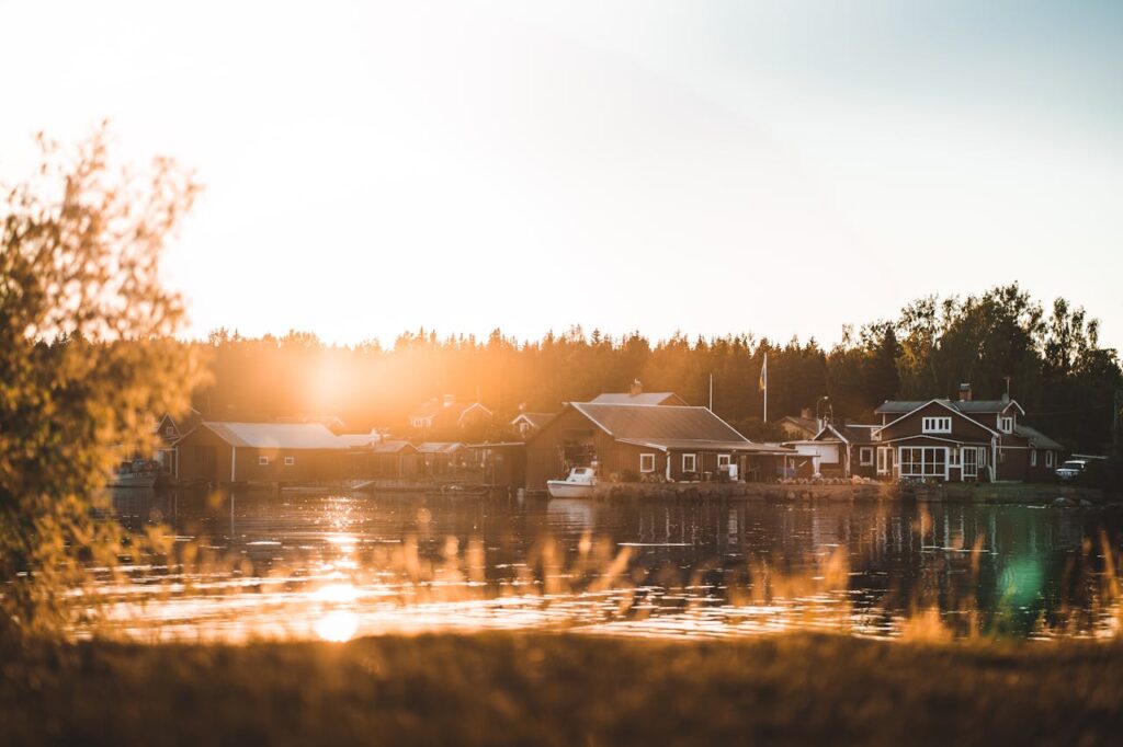 an autumn day with houses across the water