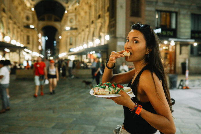 Pizza cut on the go in Milano Eating Food When Traveling Abroad