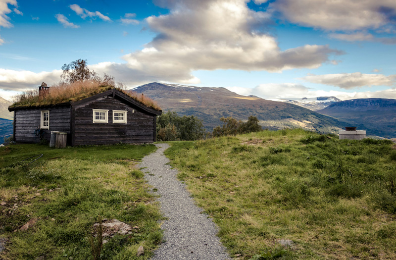 Mountain behind a brown house