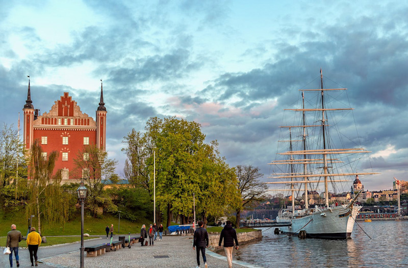 people walking near the body of water in Stockholm