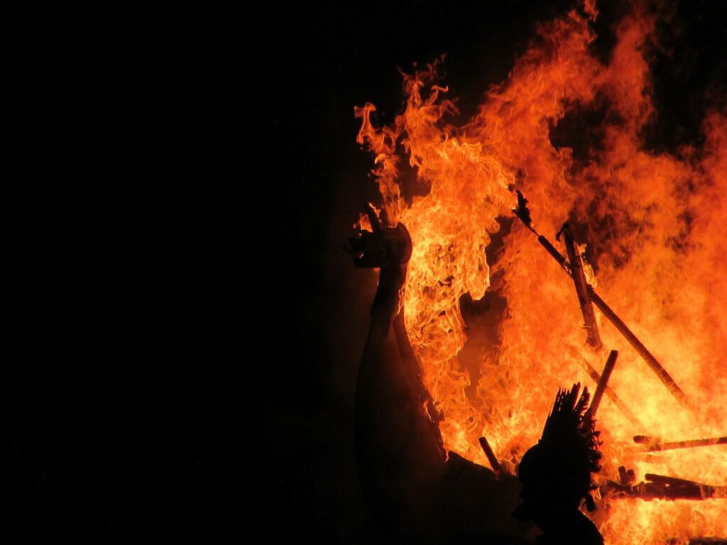 A wooden statue burning